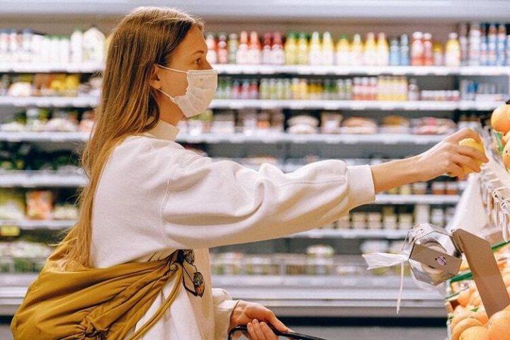 Woman wearing mask in supermarket 500 min